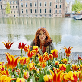 dominika behind flowers