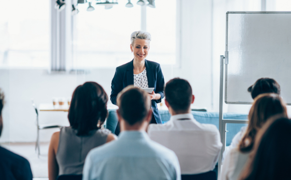 A woman is leading a training class
