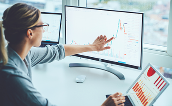 Picture of a woman in front of a computer