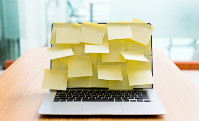 laptop with several post-it