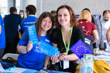 young women showing flyers