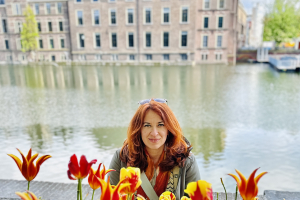 dominika behind flowers