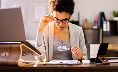 Picture of a woman reading a paper